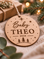 Personalised baby's first Christmas ornament with name, year, stars and Christmas trees on clear acrylic