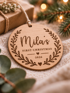 Personalised baby's first Christmas ornament with name, year and botanical wreath on clear acrylic