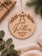 Baby announcement Christmas ornament with personalised name and elegant leafy bow garland