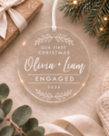 Personalised clear acrylic engagement Christmas ornament with couple names, year and Our First Christmas Engaged design