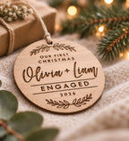 Personalised eucalyptus wood engagement Christmas ornament with couple names, year and Our First Christmas Engaged design