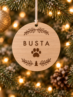 Personalised eucalyptus wood dog Christmas ornament with dog name, paw print and festive foliage design