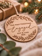 Personalised eucalyptus wood engagement Christmas ornament with couple names, year and Our First Christmas Engaged floral wreath design
