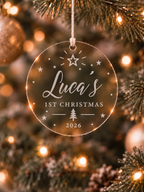 Personalised first Christmas ornament with name and year in a bow and botanical wreath design